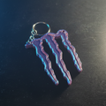3D printed energy drink keychain with cinematic dramatic lighting