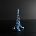 3D printed twisted Eiffel Tower with cinematic dramatic lighting
