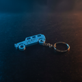3D printed Jeep keychain with cinematic dramatic lighting